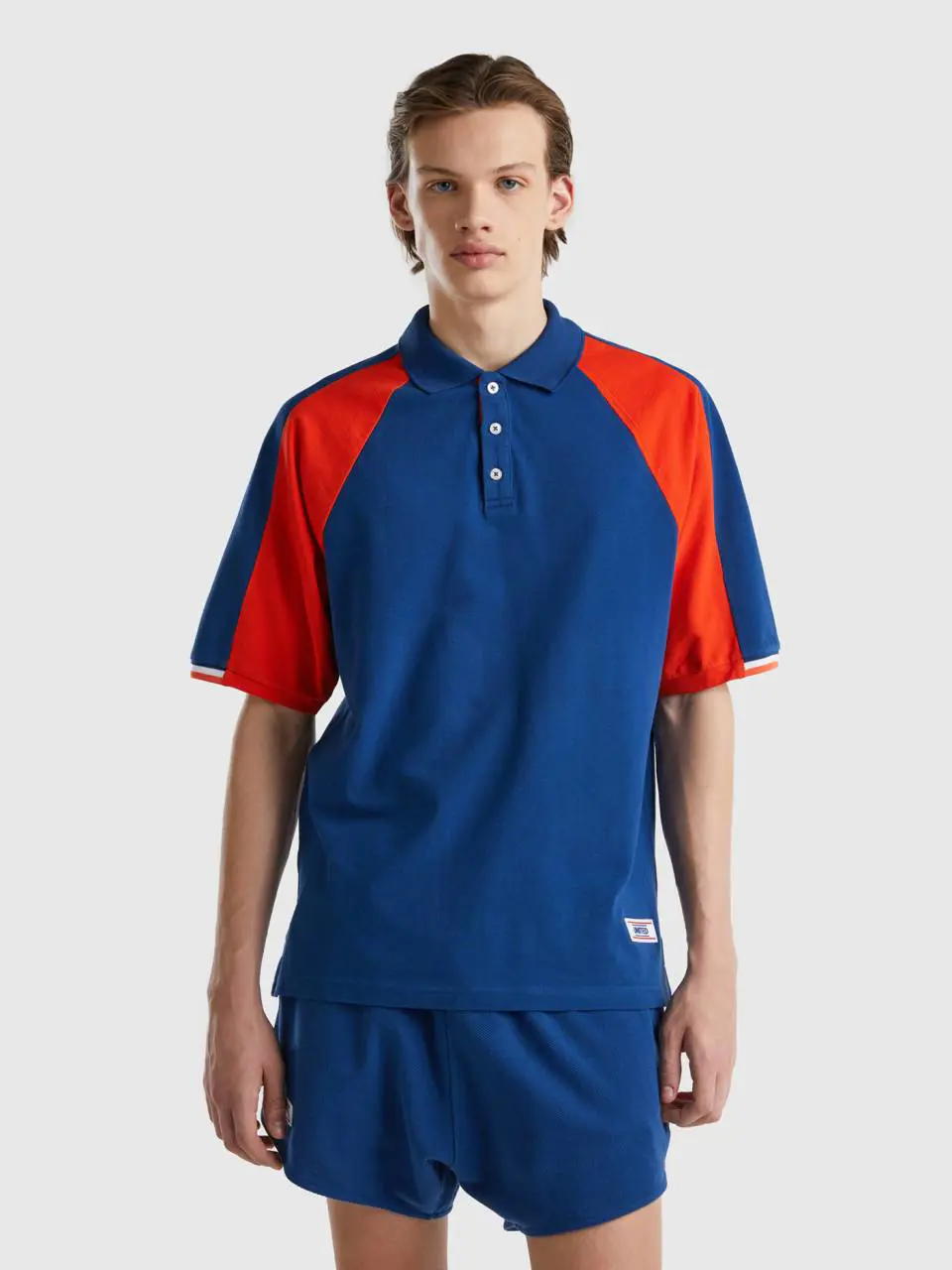 Benetton dark blue polo with red bands. 1