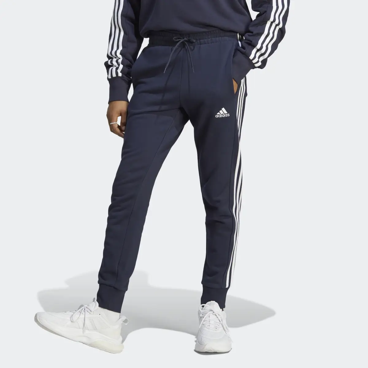 Adidas Essentials French Terry Tapered Cuff 3-Stripes Joggers. 1