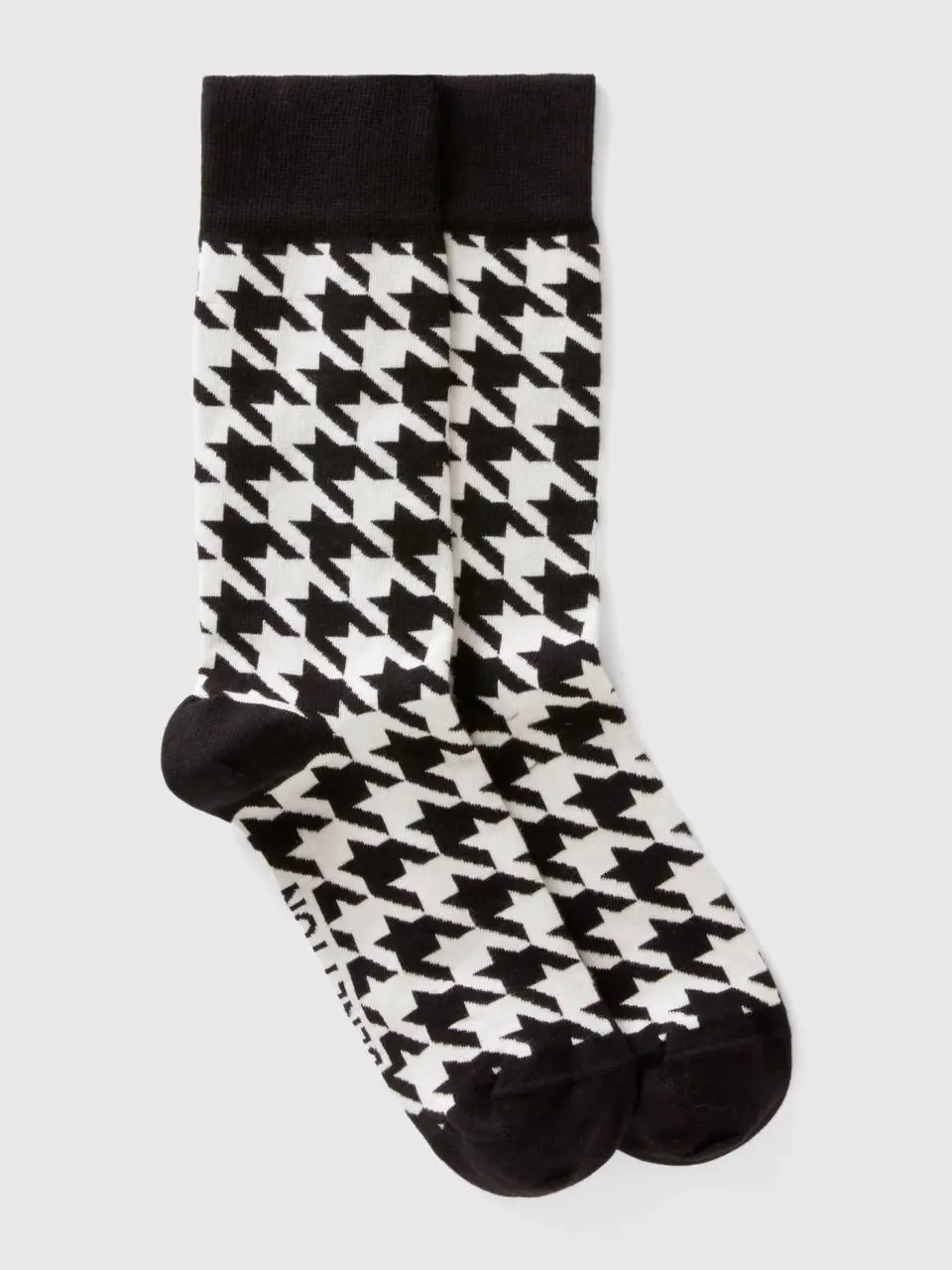 Benetton black and white houndstooth socks. 1