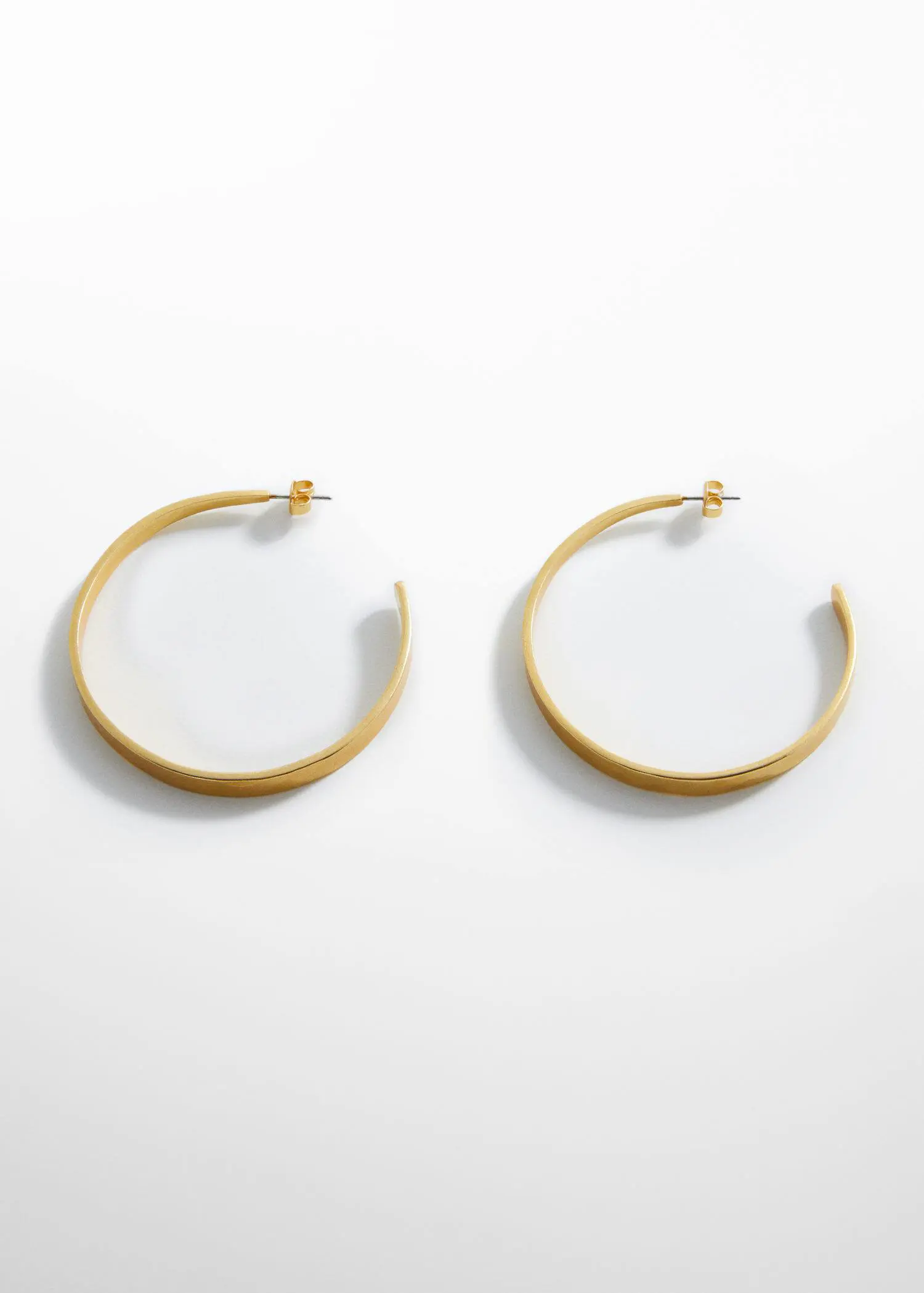Mango Embossed hoop earrings. a close up of a pair of earrings 