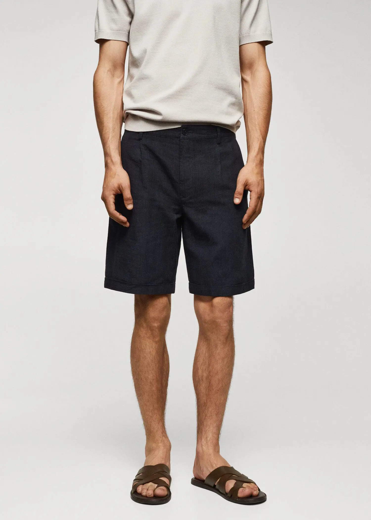 Mango Prince of Wales printed cotton-linen bermuda shorts. a man standing in front of a white wall. 