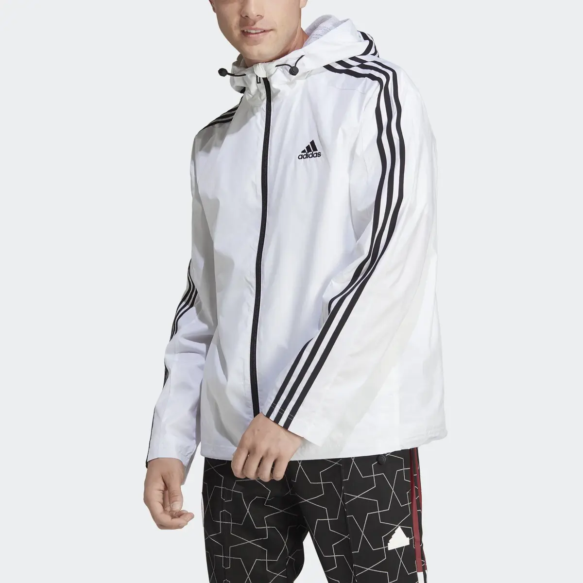 Adidas Essentials 3-Stripes Woven Windbreaker. 1