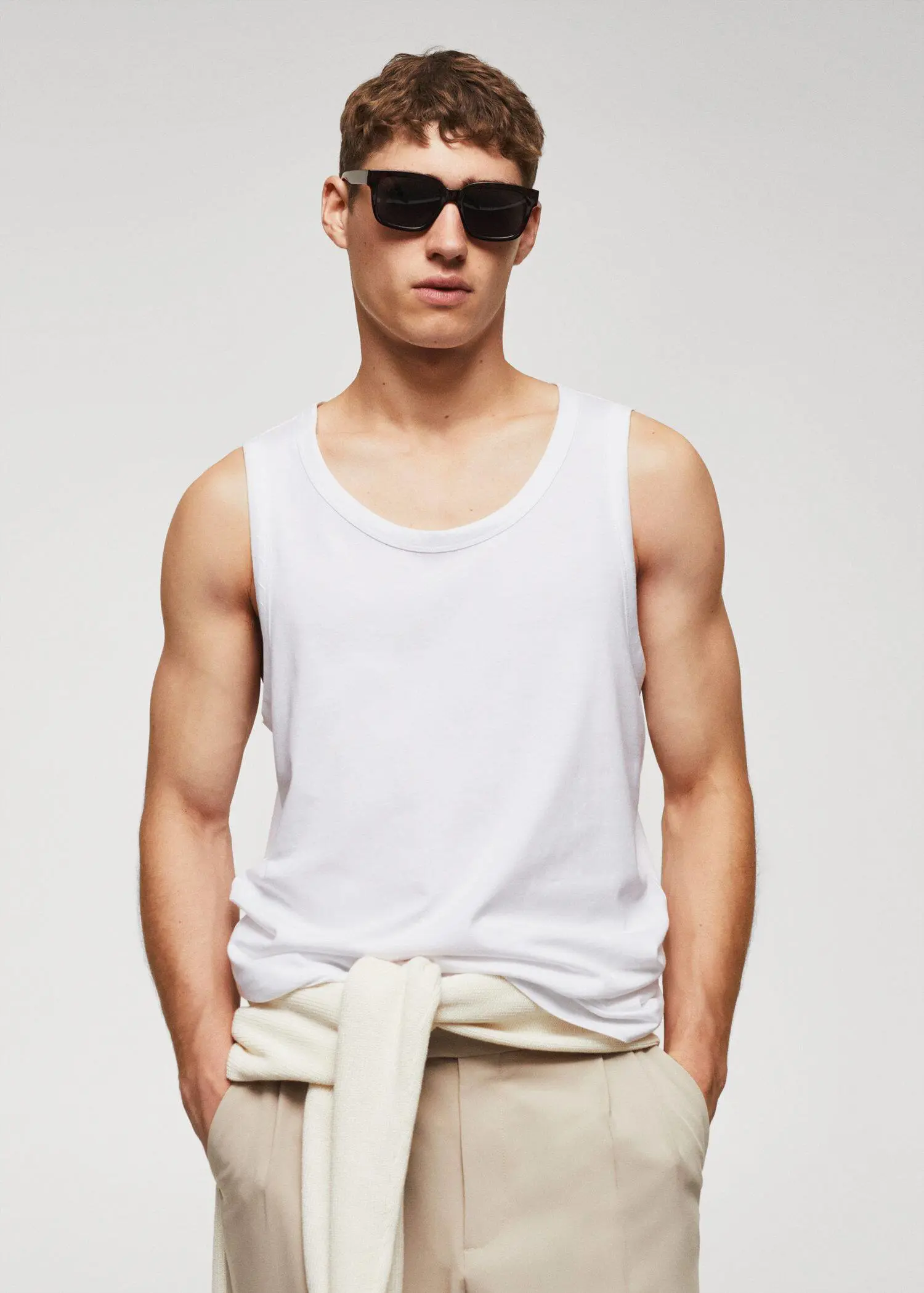 Mango Strap cotton T-shirt. a man wearing a white tank top and sunglasses. 