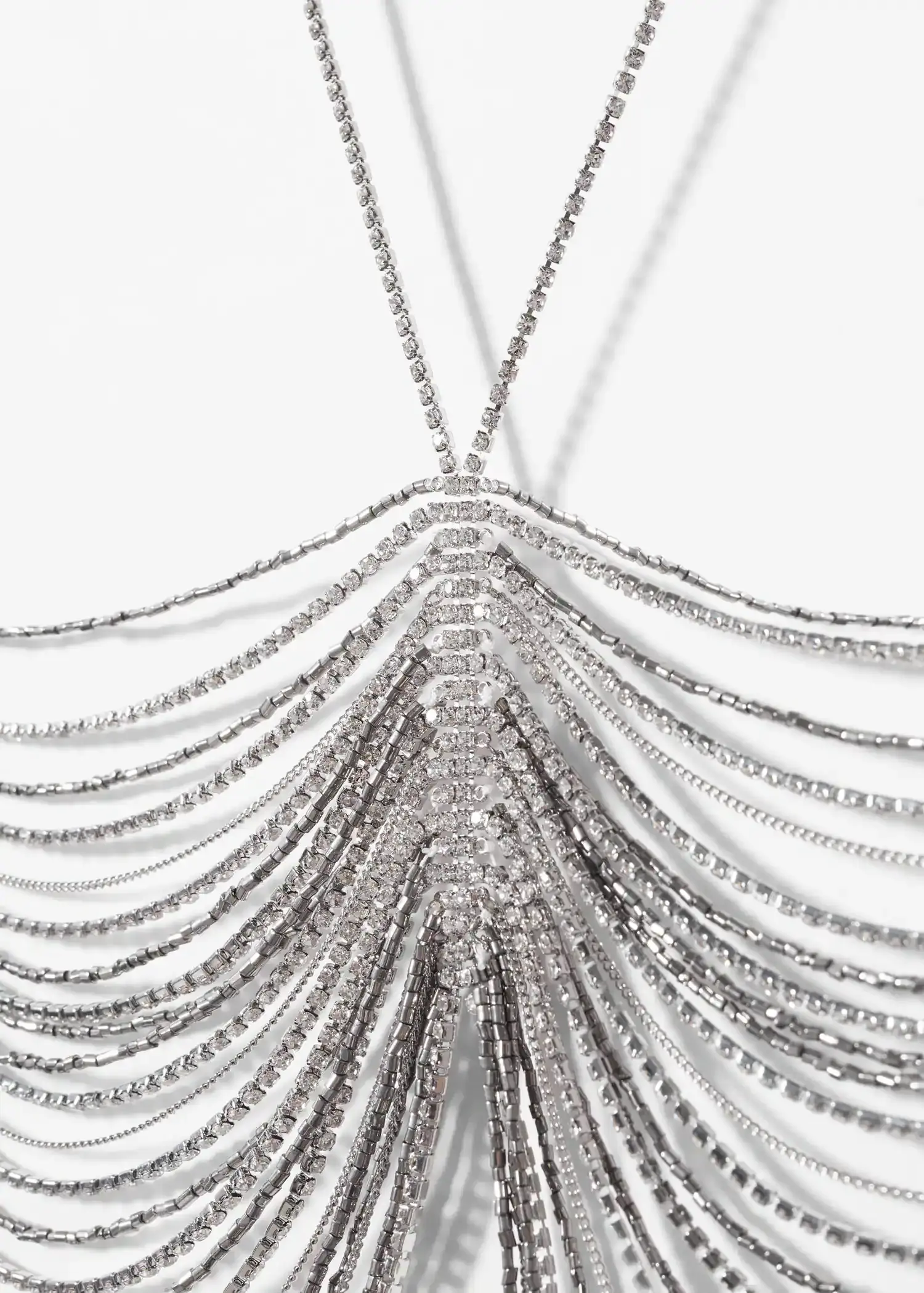 Mango Rhinestone halter bra. a close-up view of a silver necklace with many strands. 