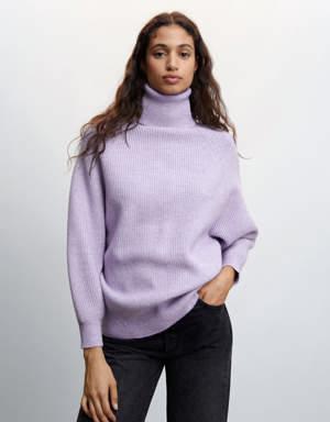 Rolled neck cable sweater