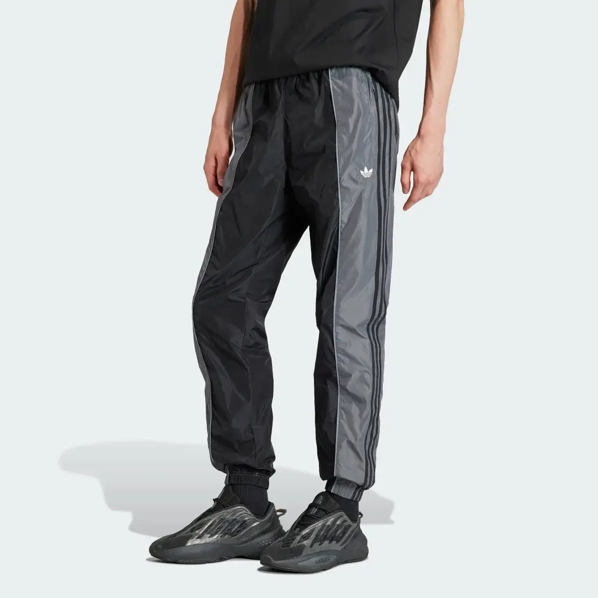 Adidas Rekive Woven Track Pants. 1