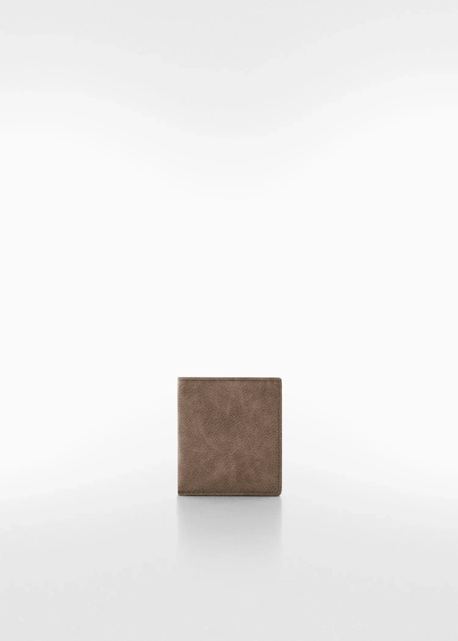 Mango Anti-contactless wallet. a brown wallet sitting on top of a white table. 