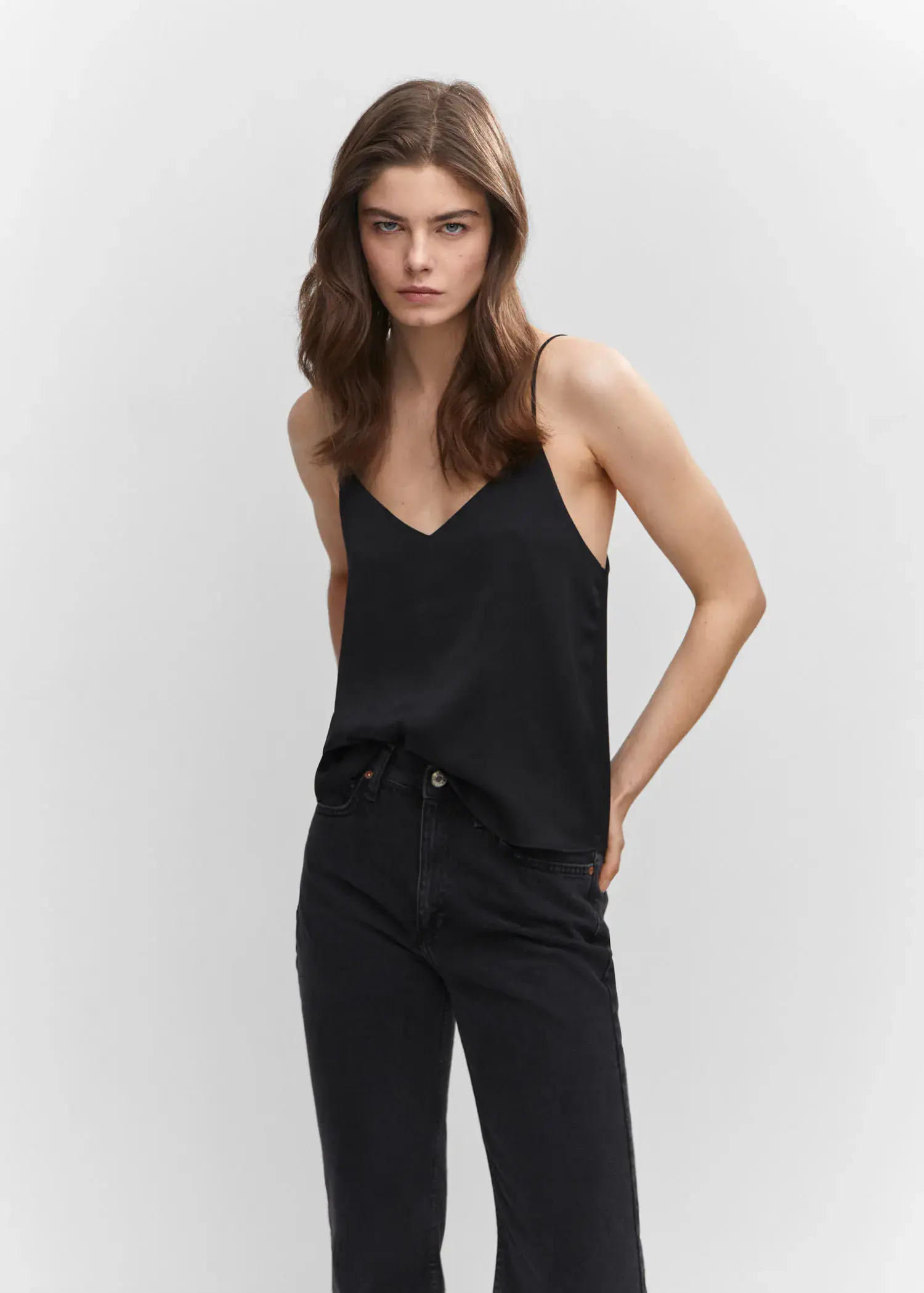 Mango Satin top with straps. a woman wearing black jeans and a black tank top. 
