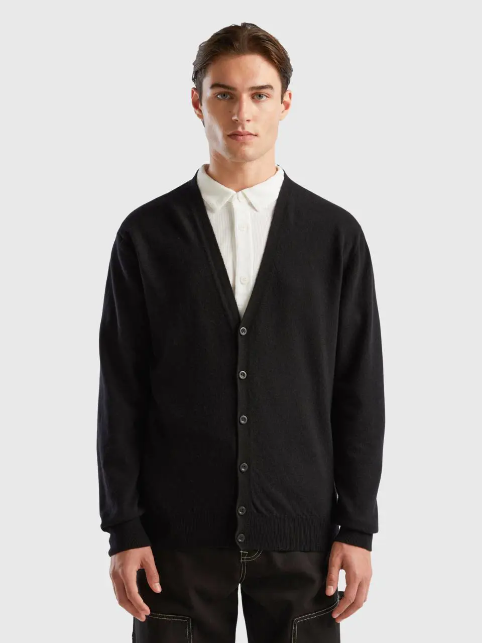 Benetton black v-neck cardigan in pure merino wool. 1