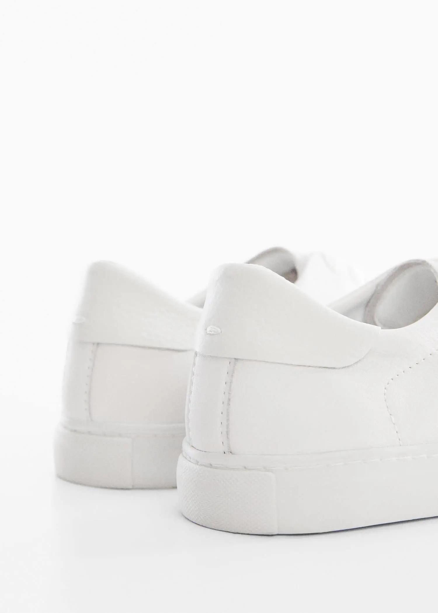 Mango Leather panel sneakers. a close up of a pair of white shoes 
