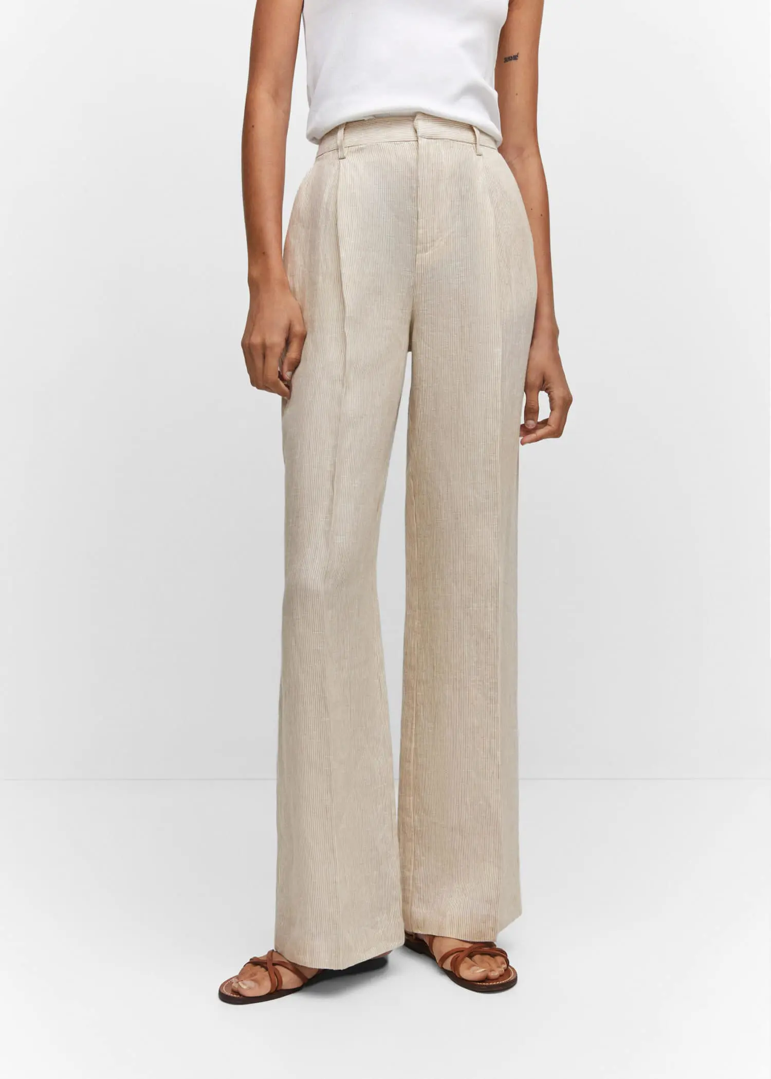 Mango Straight linen-blend pants. a person wearing a white outfit standing in front of a white wall. 