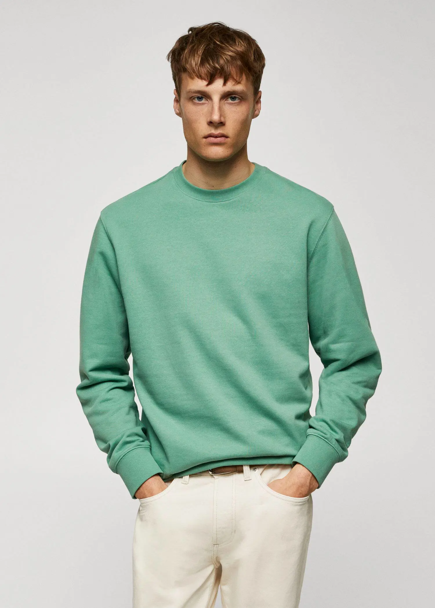 Mango 100% cotton basic sweatshirt . a man in a green sweatshirt is posing for a picture. 