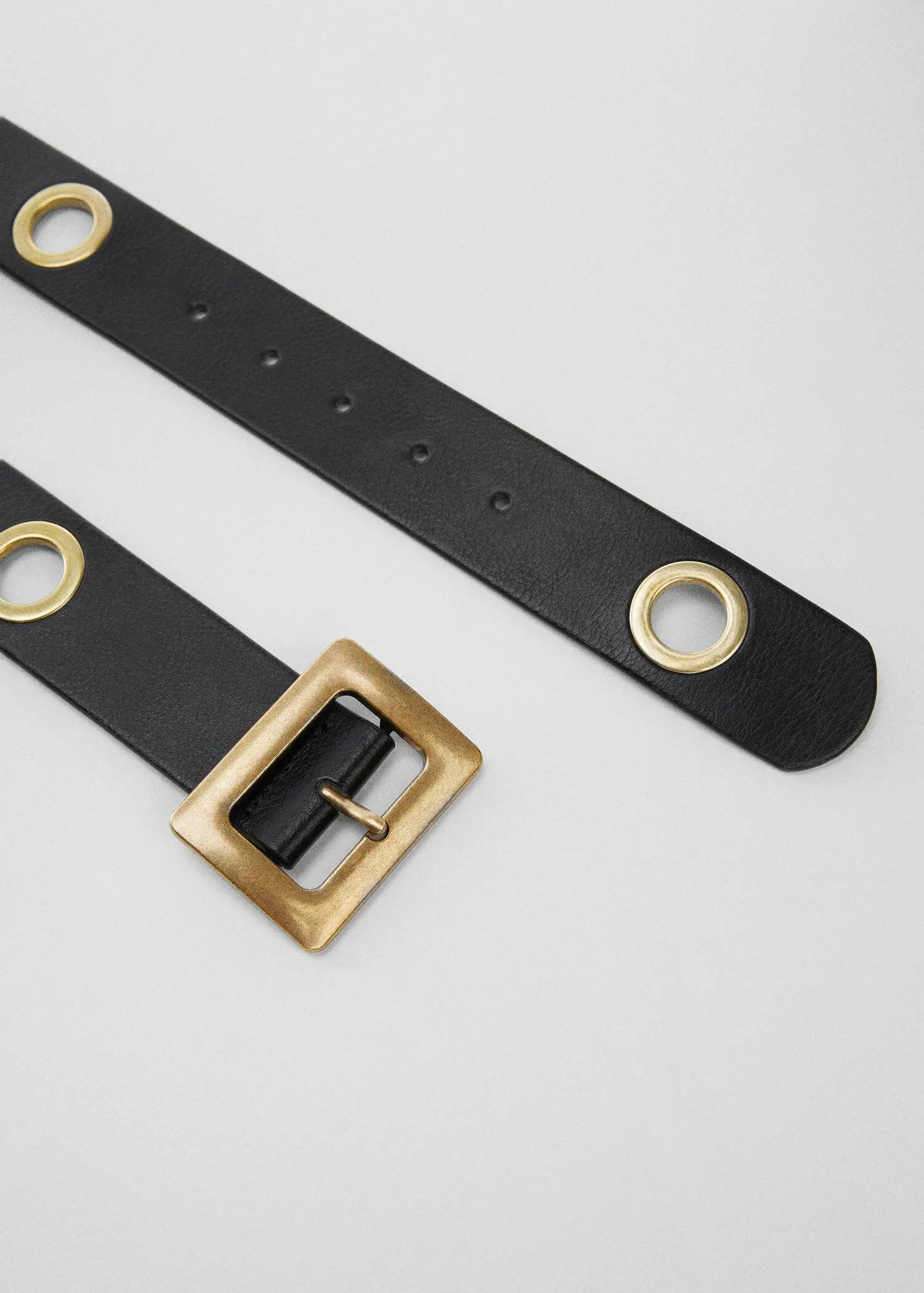 Mango Hoop belt. a close-up of a black belt with a gold buckle. 