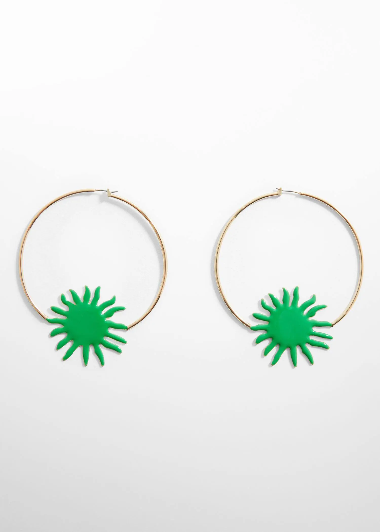 Mango Maxi hoop earrings. a pair of green earrings hanging on a white wall. 