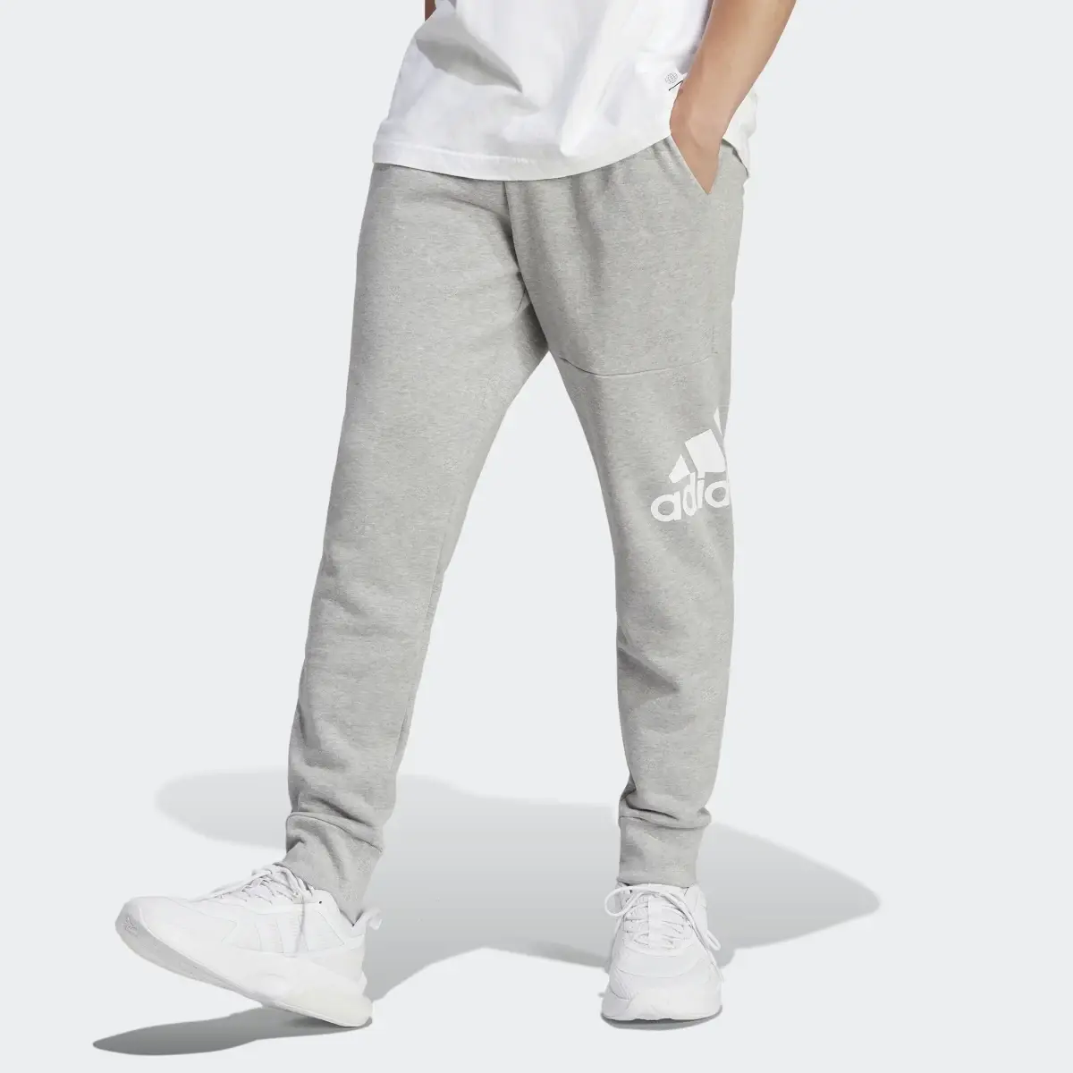 Adidas Essentials French Terry Tapered Cuff Logo Pants. 1