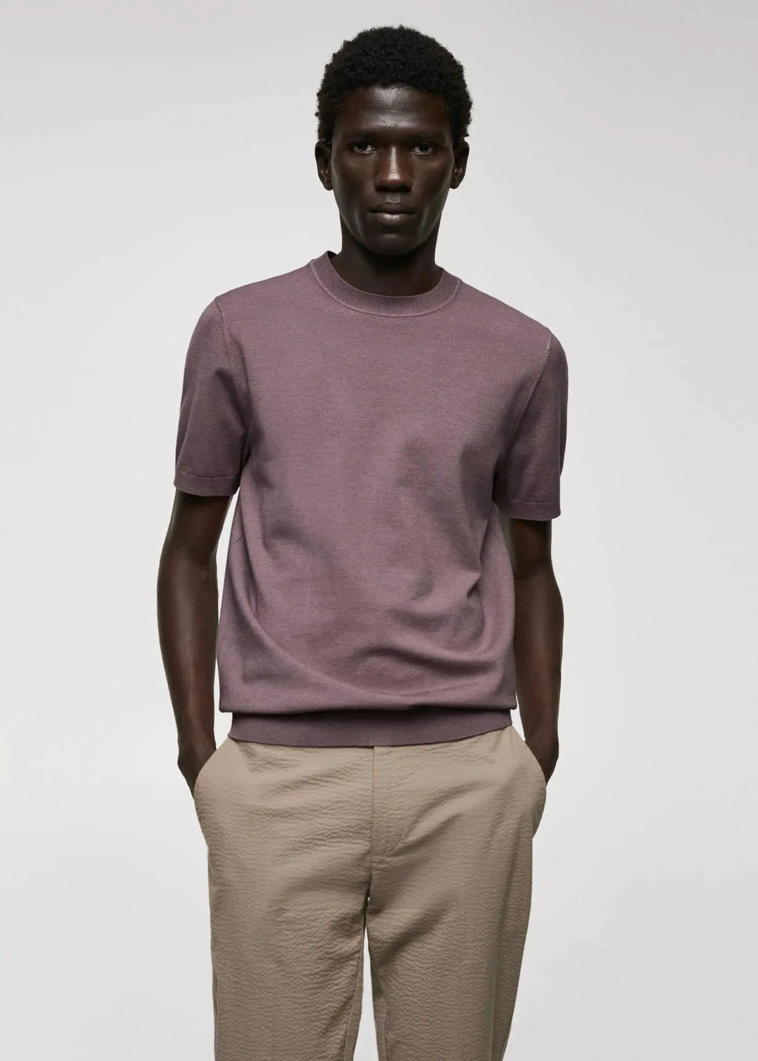 Mango Fine-knit T-shirt. a man wearing a purple shirt and beige pants. 