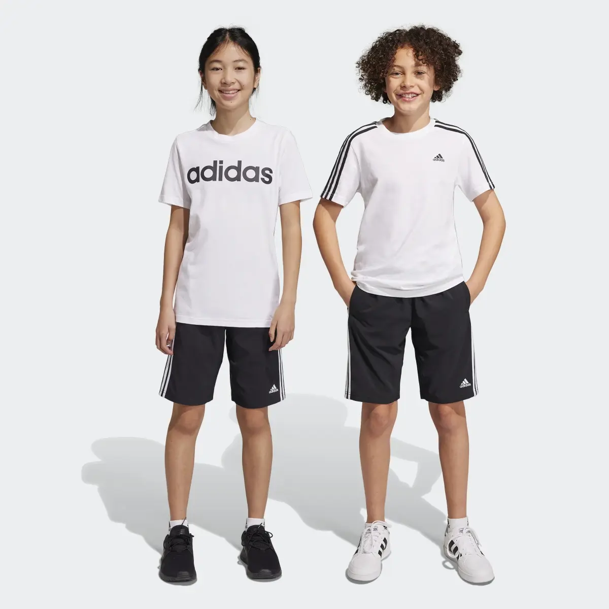 Adidas Essentials 3-Stripes Woven Shorts. 1