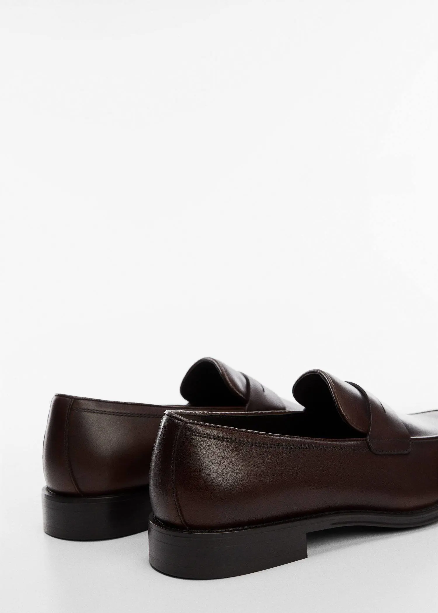 Mango Aged-leather loafers. a close up of a pair of brown shoes. 