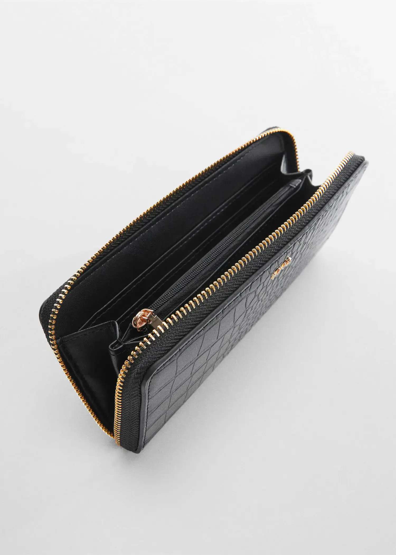 Mango Crocodile wallet with logo. a close-up of the inside of a black wallet. 