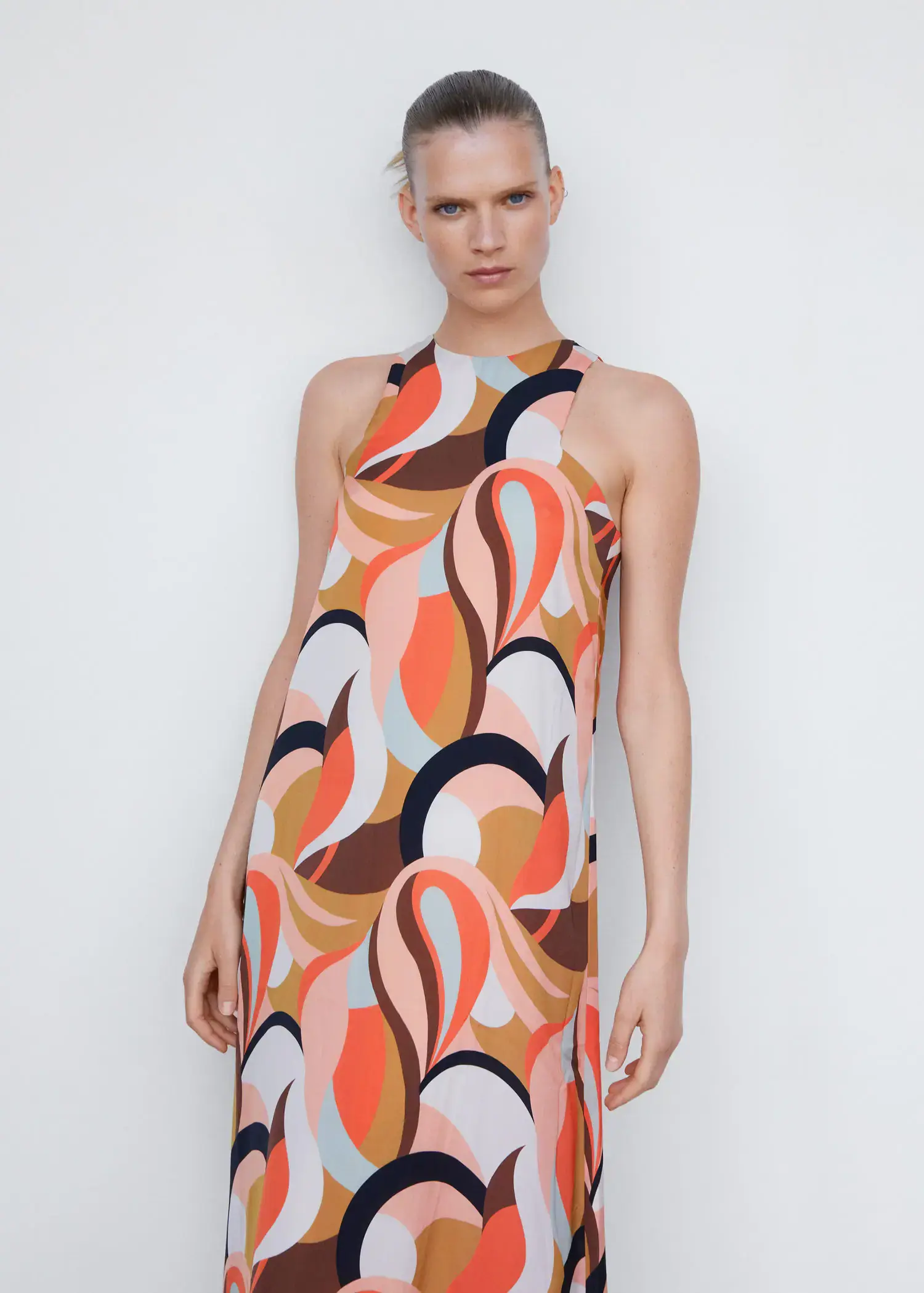 Mango Printed halter gown. a woman wearing a colorful dress posing for a picture. 