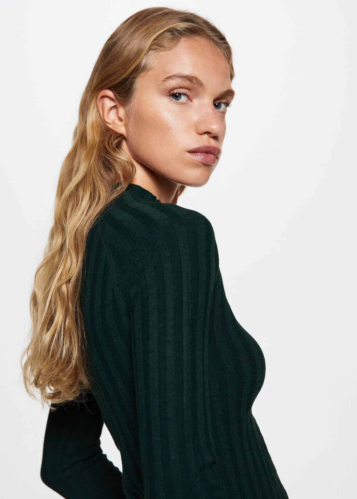 Mango High collar ribbed knit sweater. a beautiful young woman with long blonde hair. 