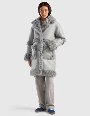 coat in imitation leather with faux fur