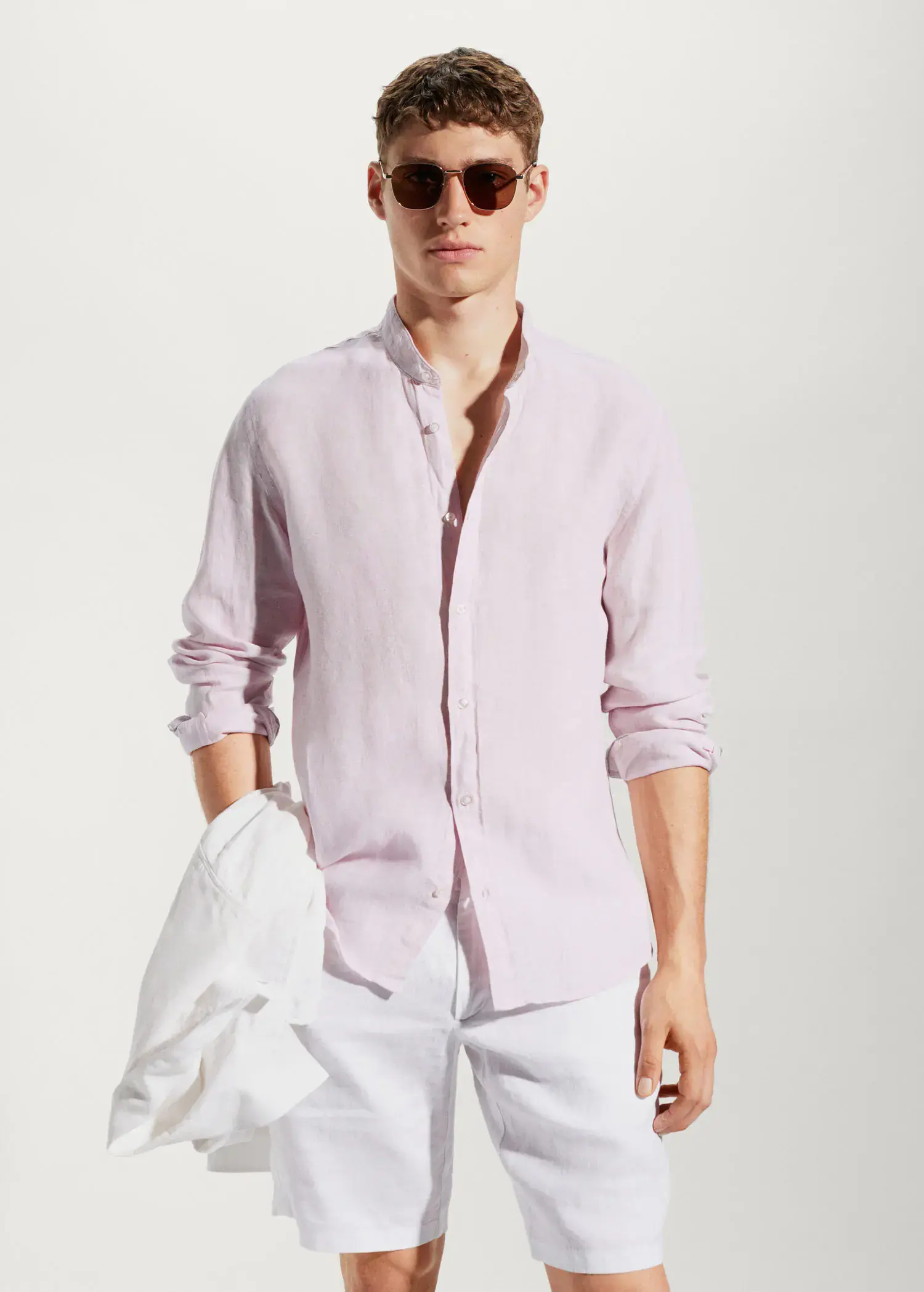 Mango 100% linen Mao collar shirt. a man wearing a pink shirt and white shorts. 