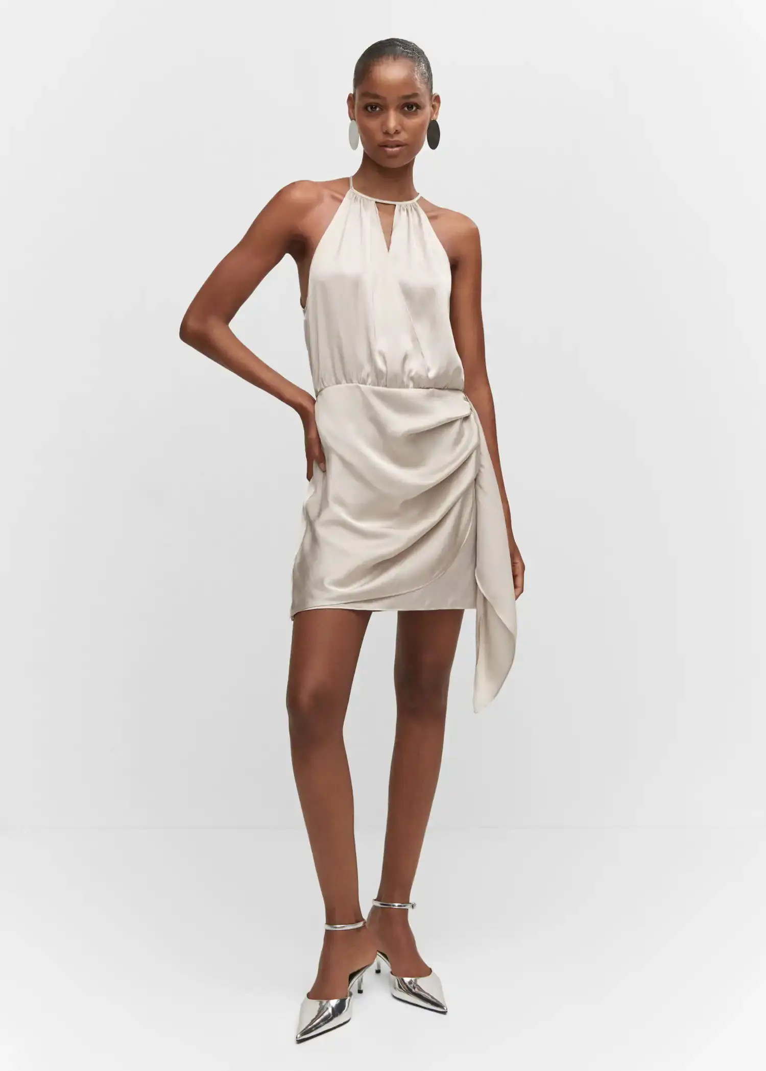 Mango Satin halter neck dress. a woman in a white dress posing for a picture. 