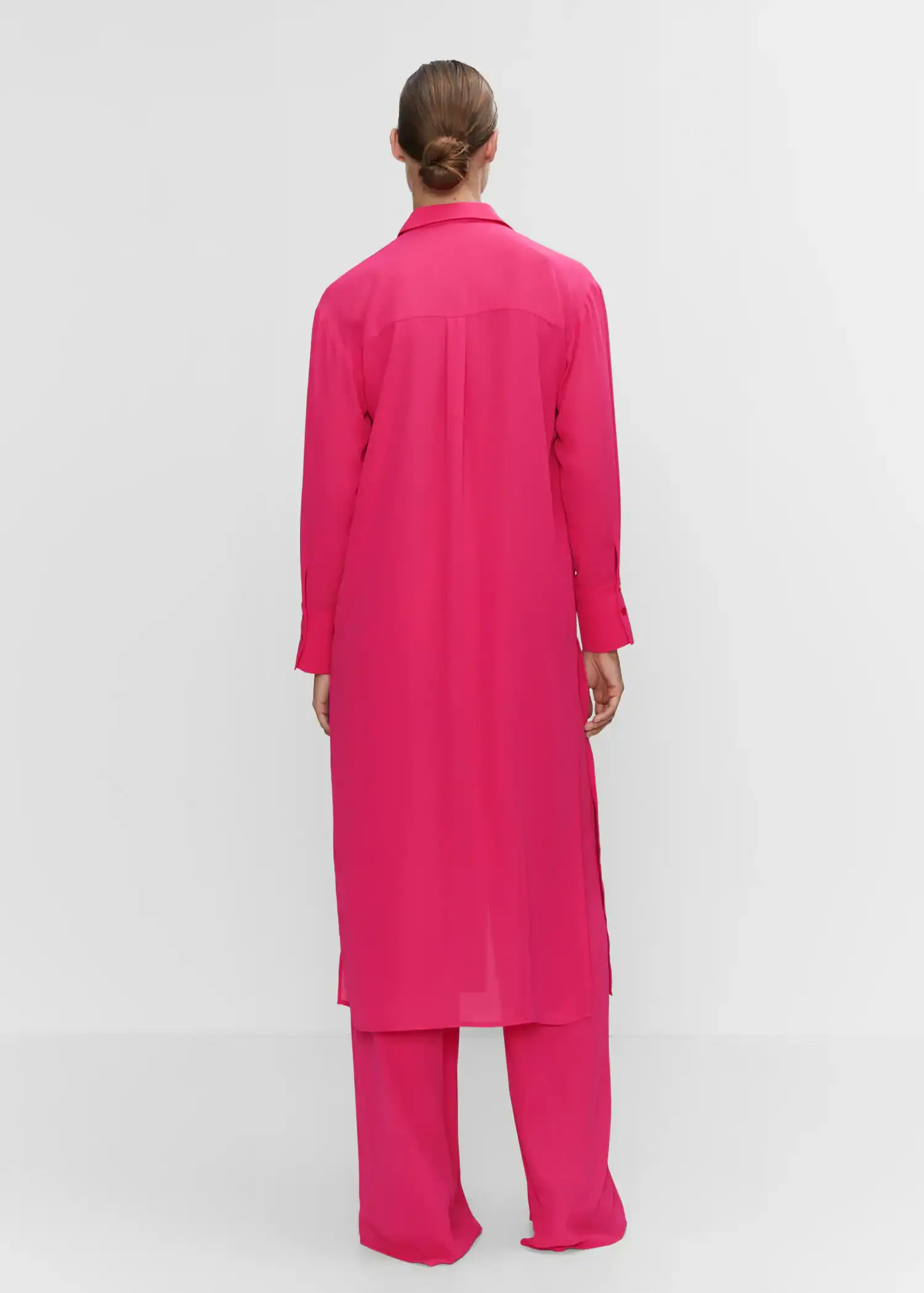 Mango Shirt dress with slits. a person wearing a long pink robe and pants. 