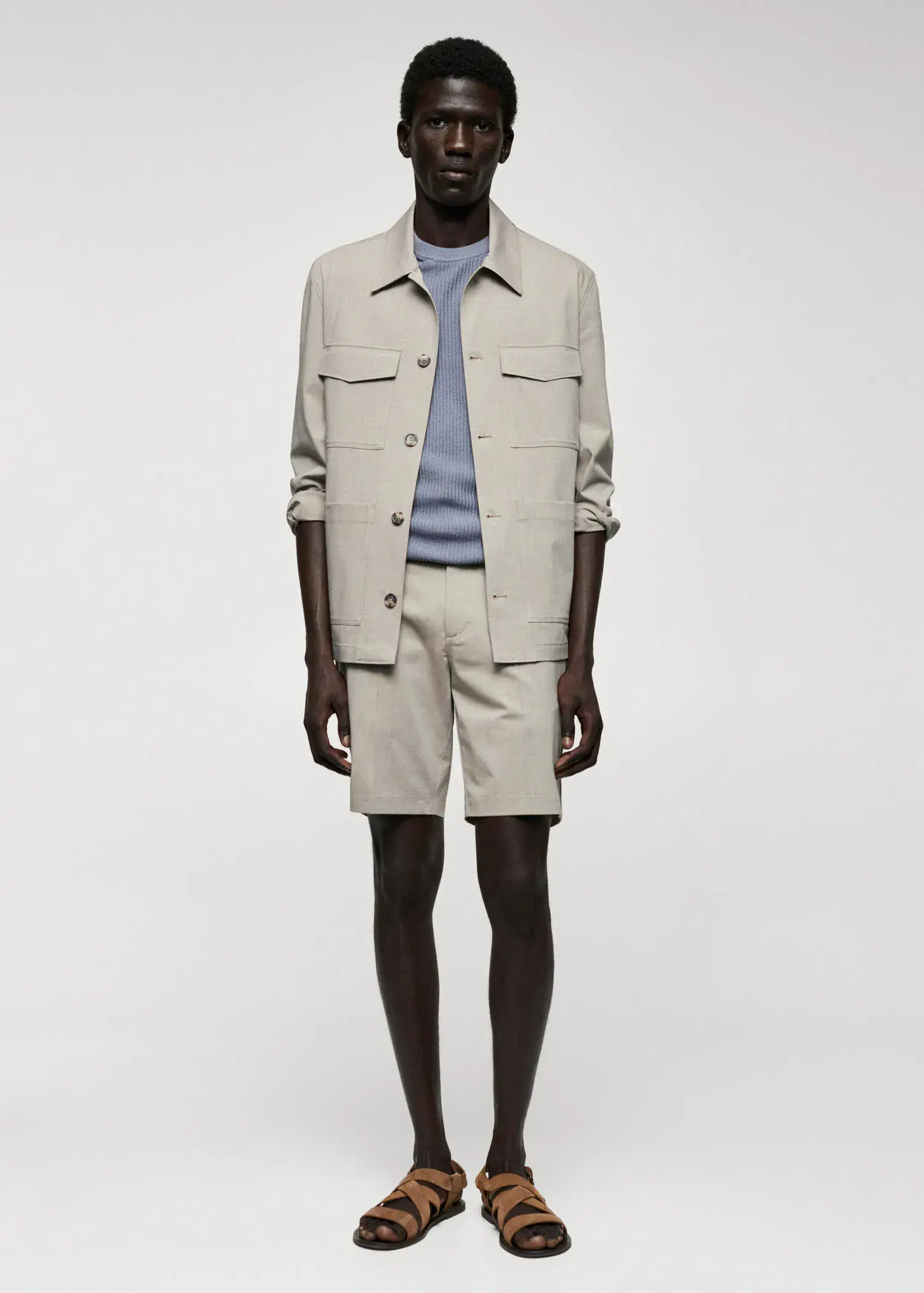 Mango Lightweight pocket jacket. a man in a tan jacket and shorts. 