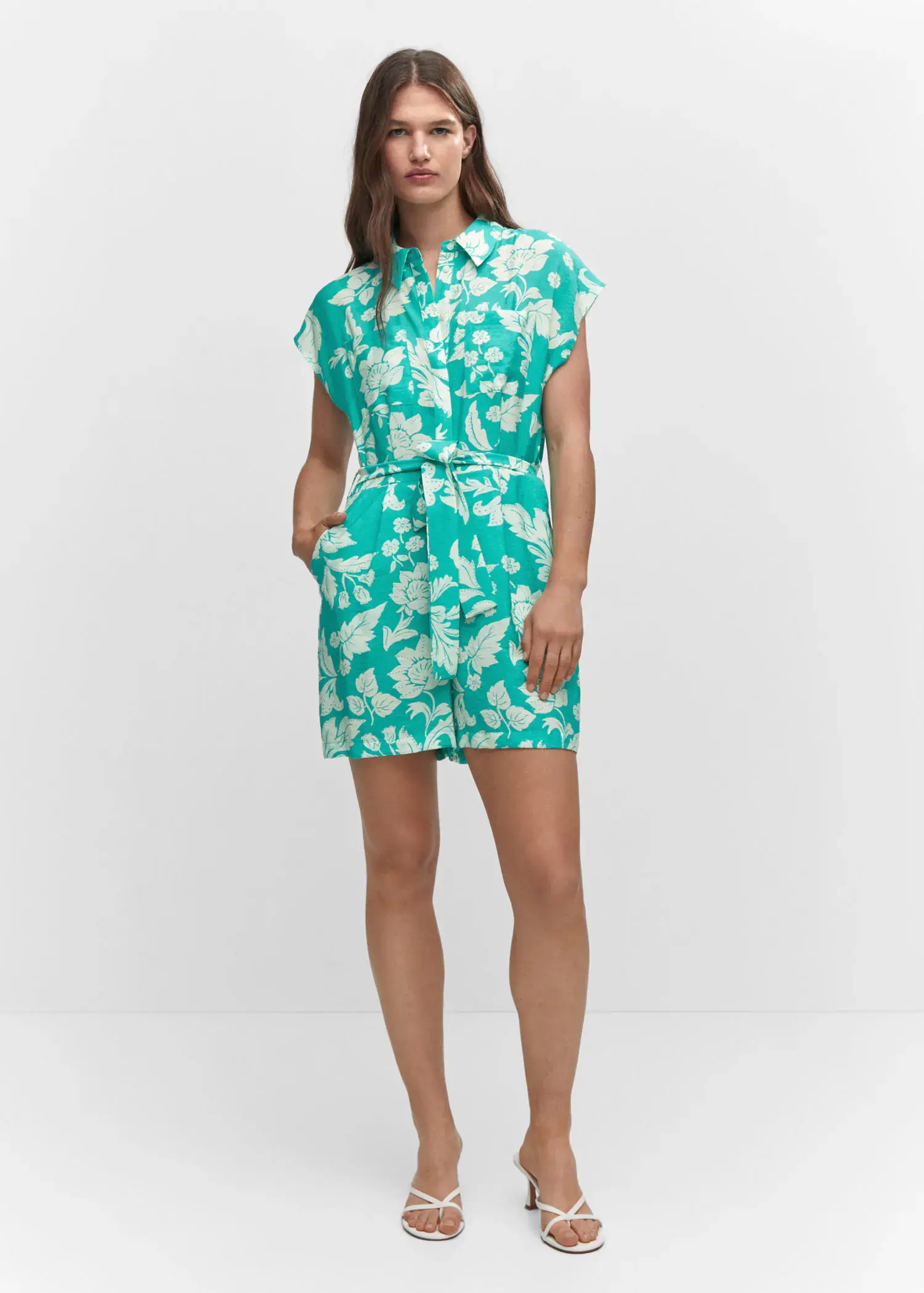 Mango Floral-print jumpsuit with tie. a woman wearing a green and white floral dress. 