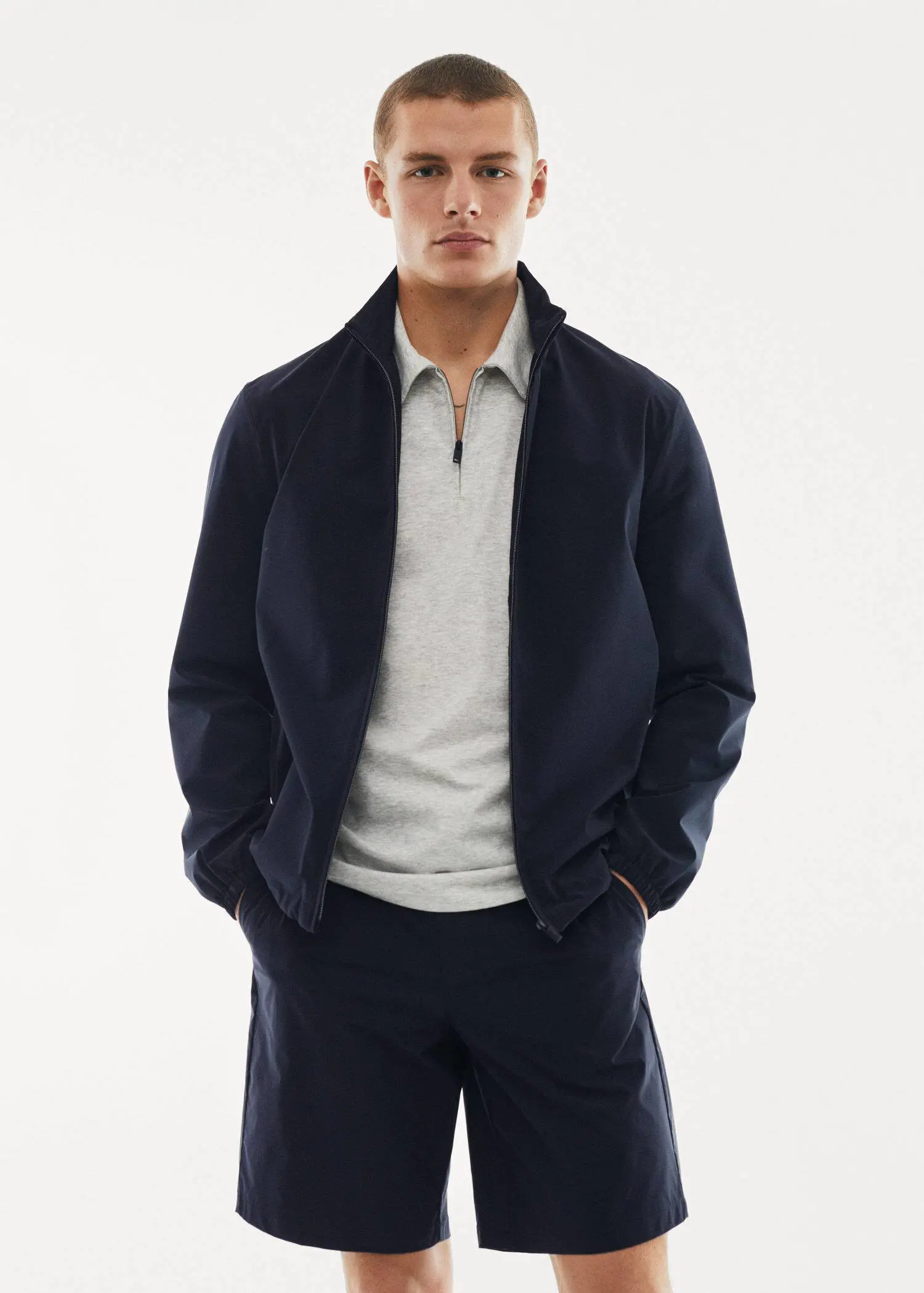 Mango Water-repellent bomber jacket. a man in a black jacket and white shirt. 