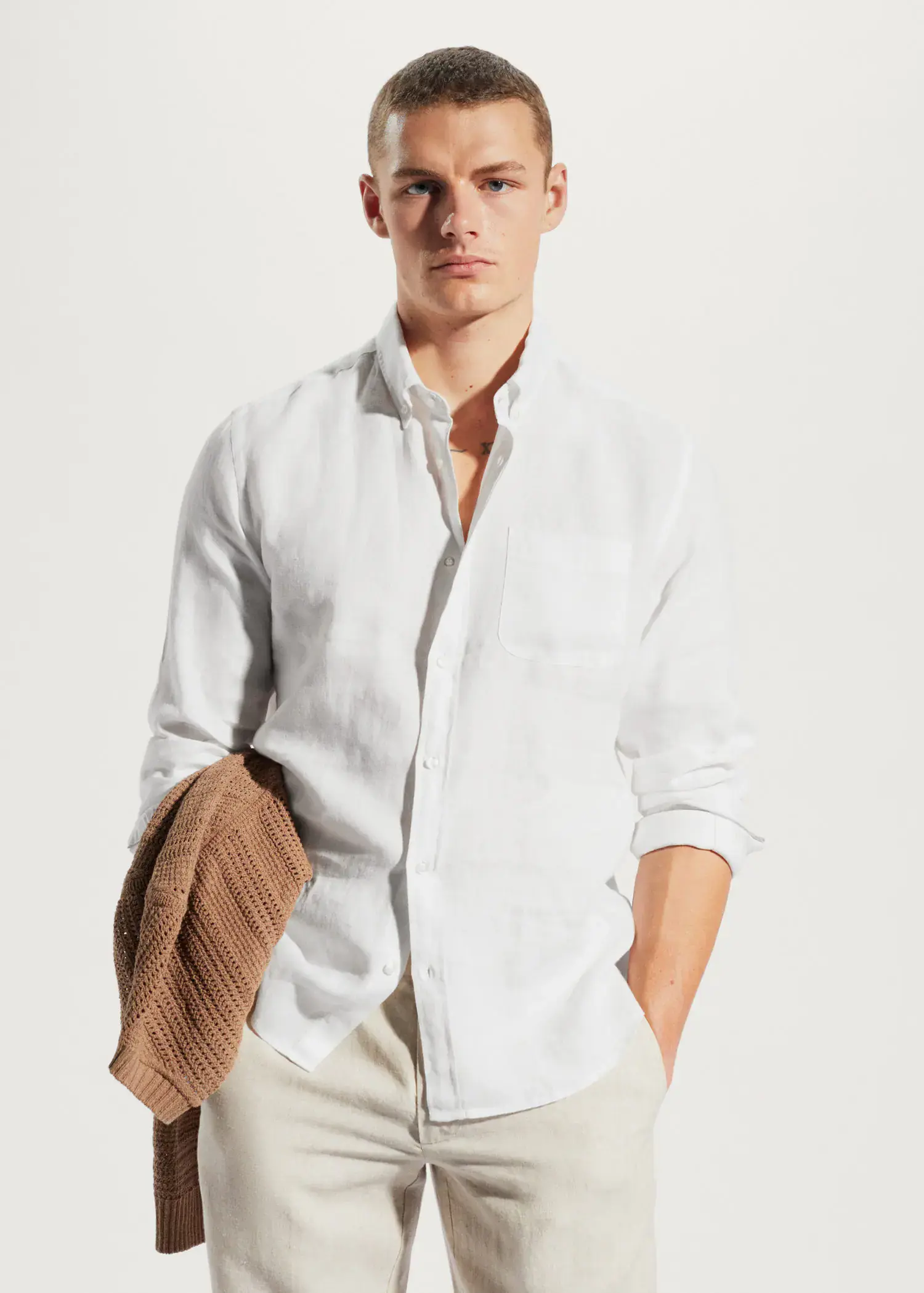 Mango 100% linen slim-fit shirt. a man in a white shirt and a hat. 