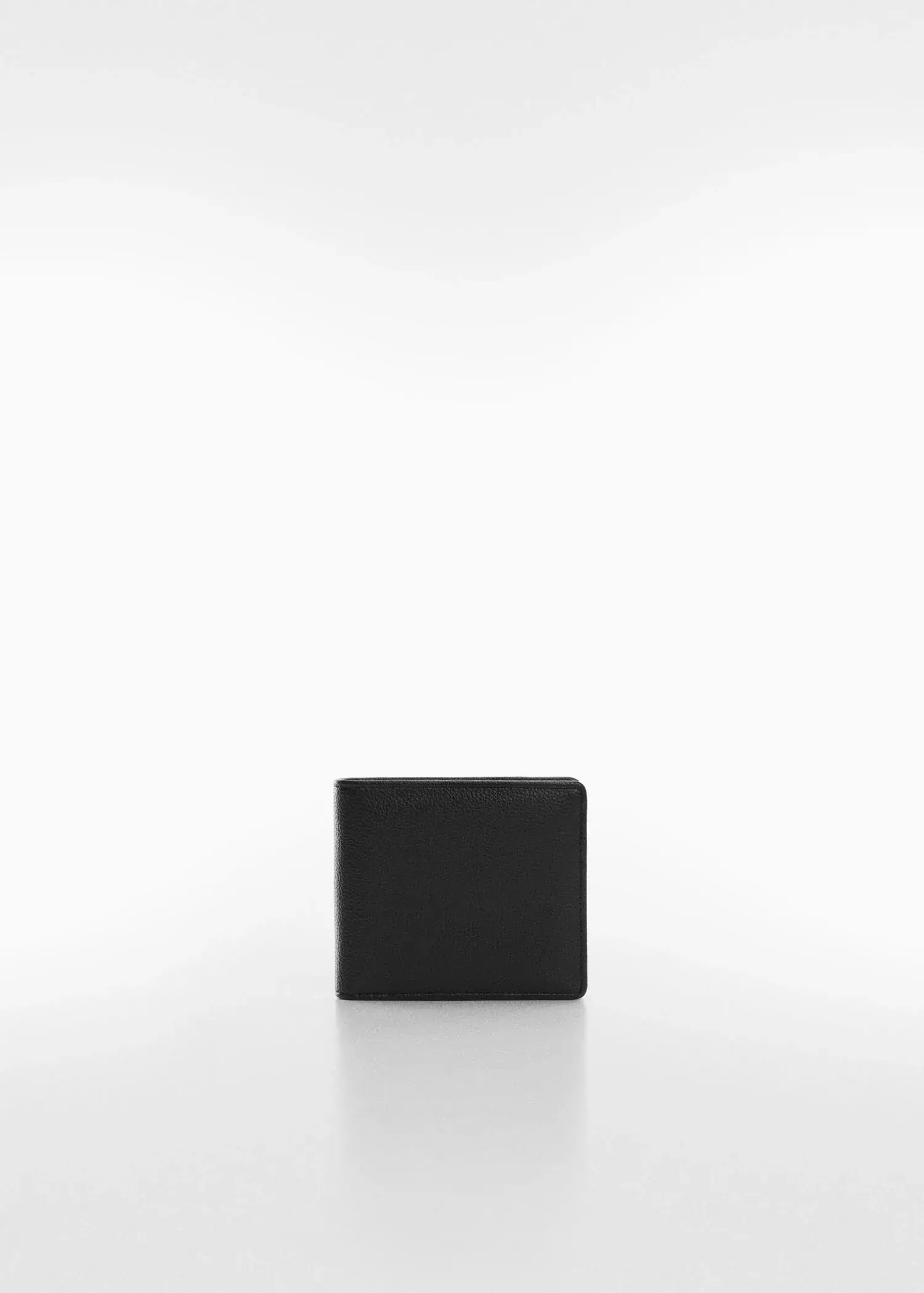 Mango Anti-contactless wallet. a black wallet sitting on top of a white table. 