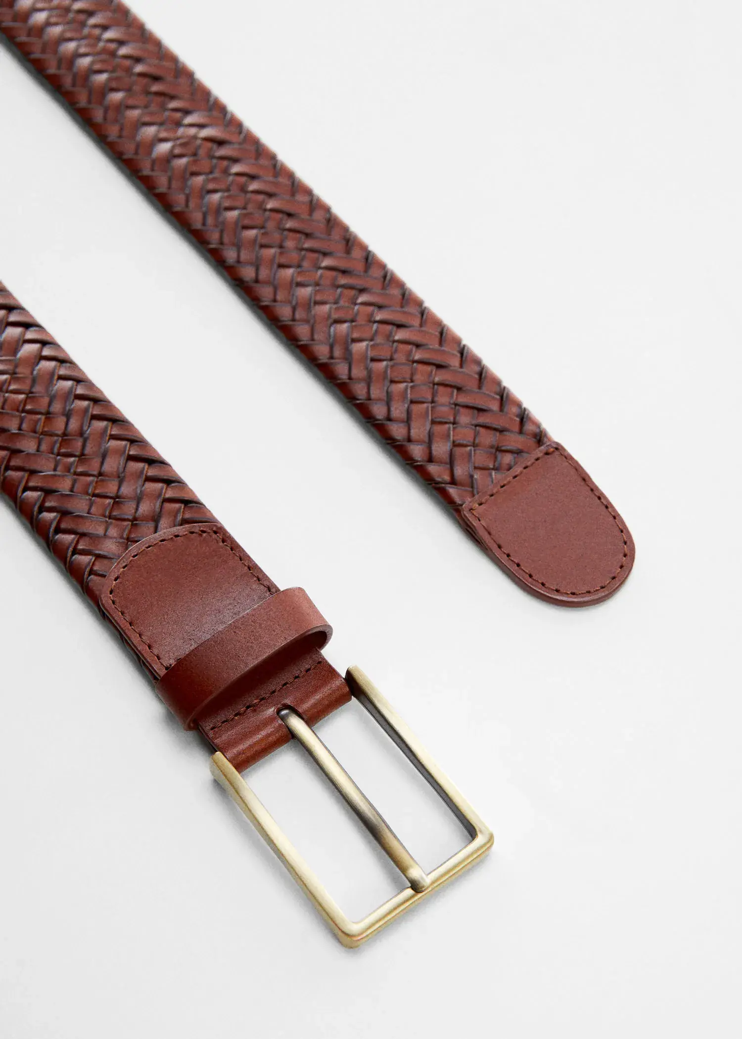 Mango Braided leather belt. a close-up of a brown leather belt with a gold buckle. 