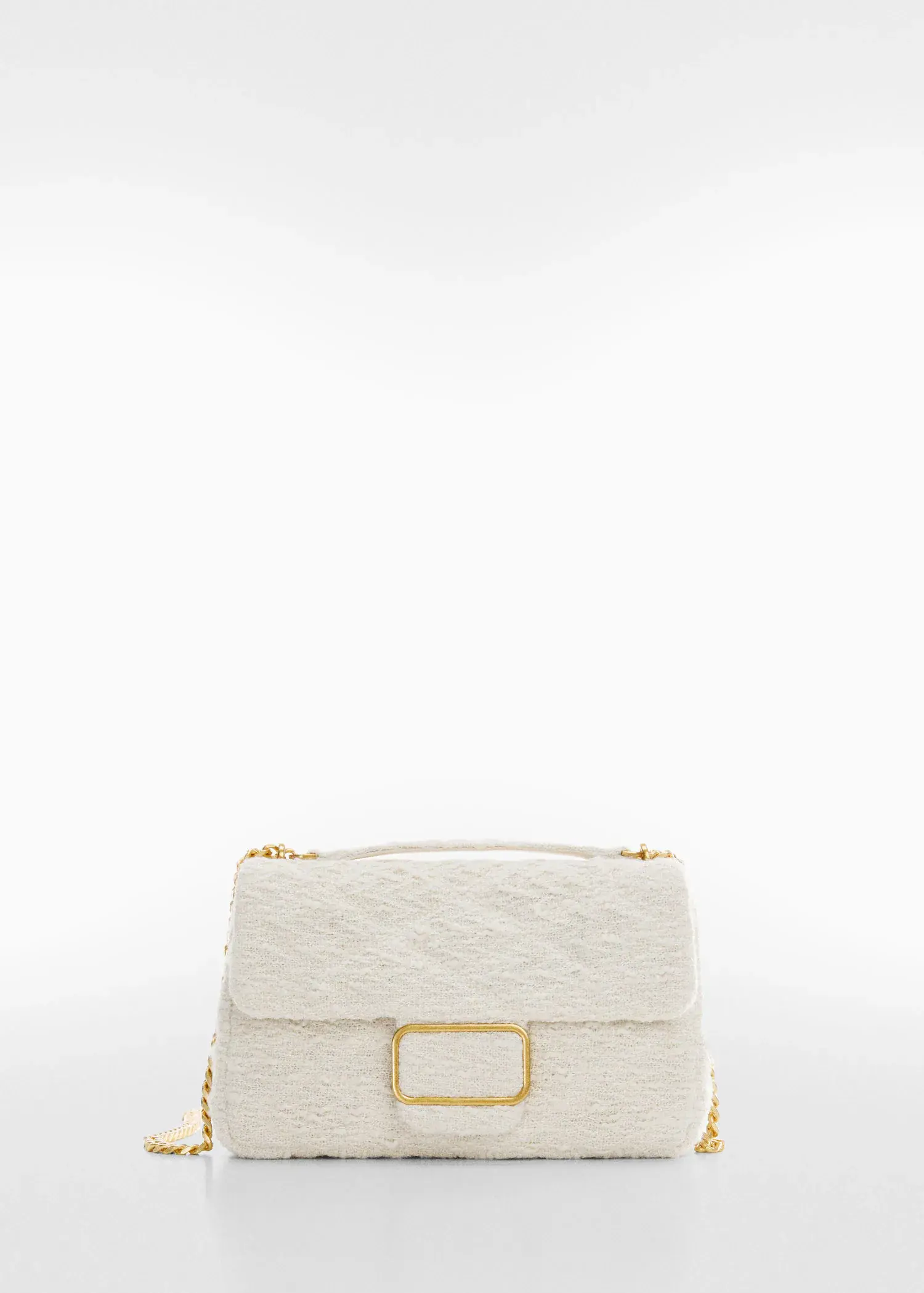 Mango Textured chain bag. a close up of a white purse on a white background 
