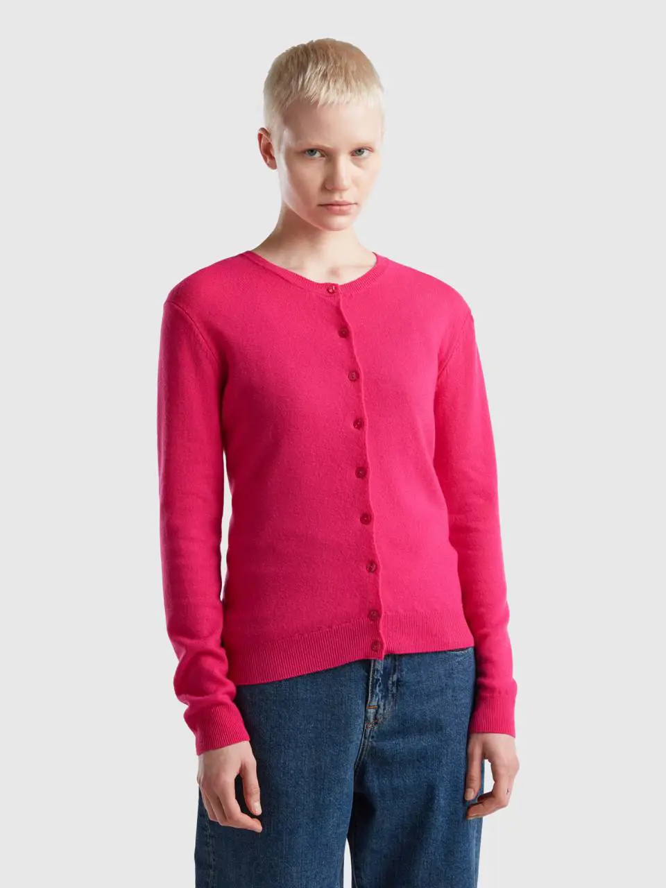 Benetton fuchsia crew neck cardigan in pure merino wool. 1