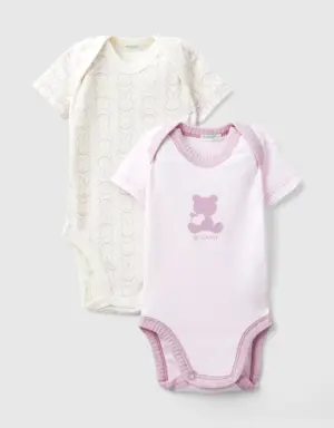 two short sleeve bodysuits in organic cotton