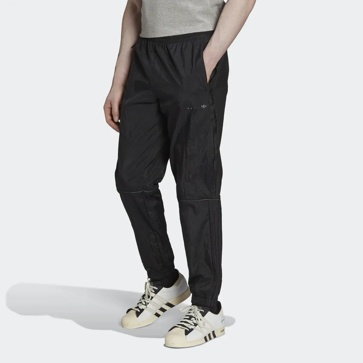Adidas Pantalon de survêtement mix de matières Reveal. 1