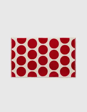 white bathroom rug with red polka dots