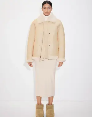 Reversible leather and fur-effect coat