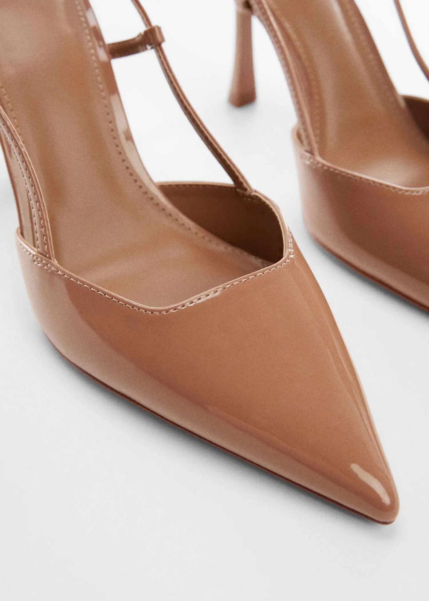 Mango Pointed-toe heeled shoes . a close up of a pair of shoes on a white surface 