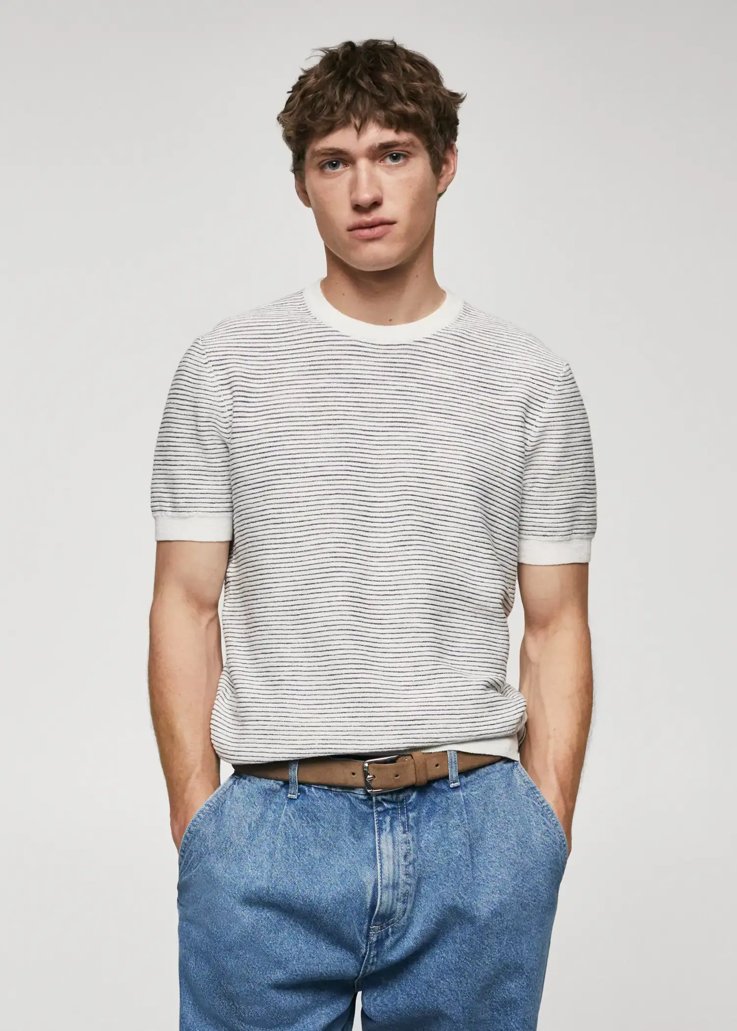 Mango Textured striped T-shirt. a young man wearing jeans and a t-shirt. 