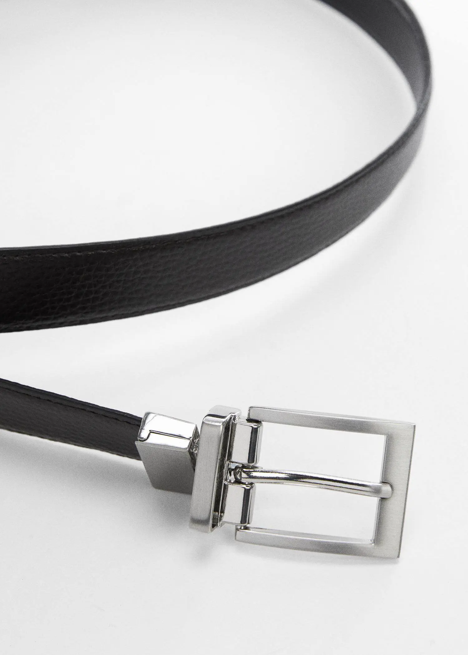 Mango Dress with leather belt. a close-up of a black belt with a silver buckle. 