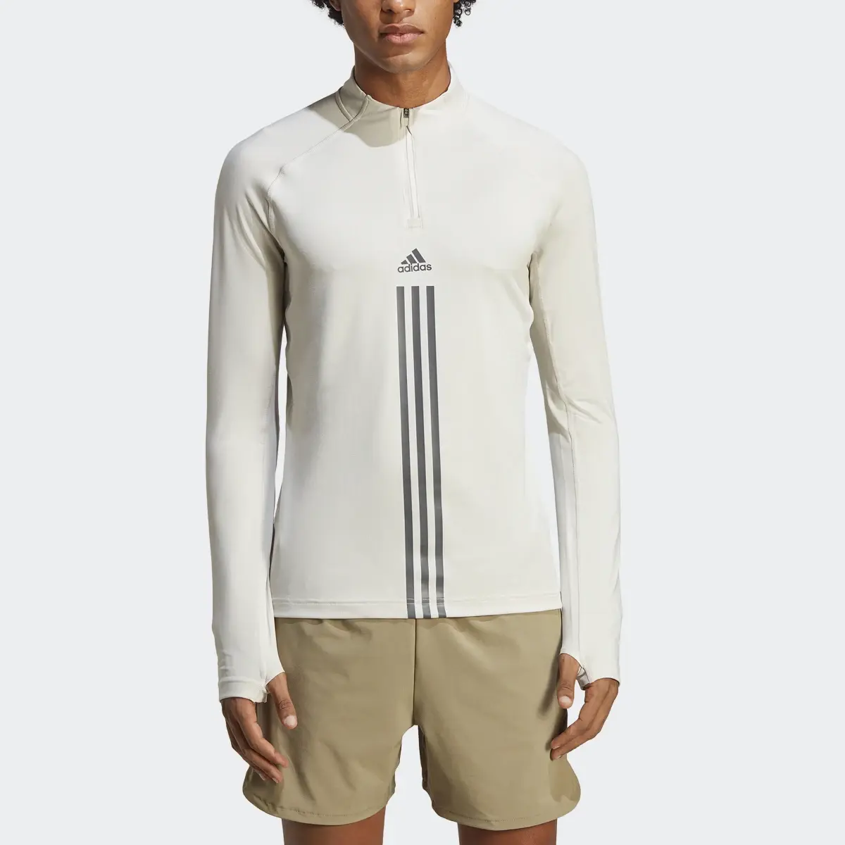 Adidas AlphaStrength 1/4 Zip Long Sleeve Top. 1