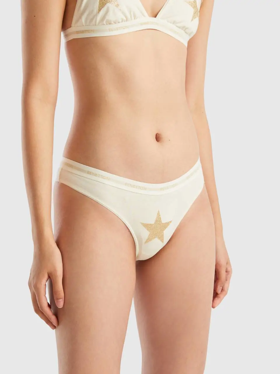 Benetton thong with glittery star. 1