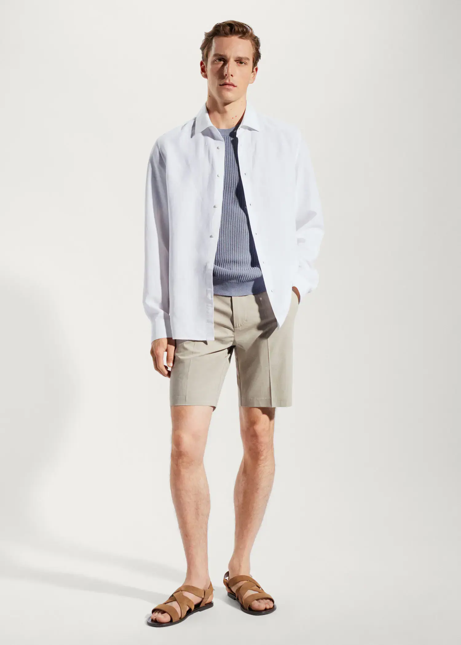 Mango Light tencel-linen shirt. a man wearing a white shirt and shorts. 