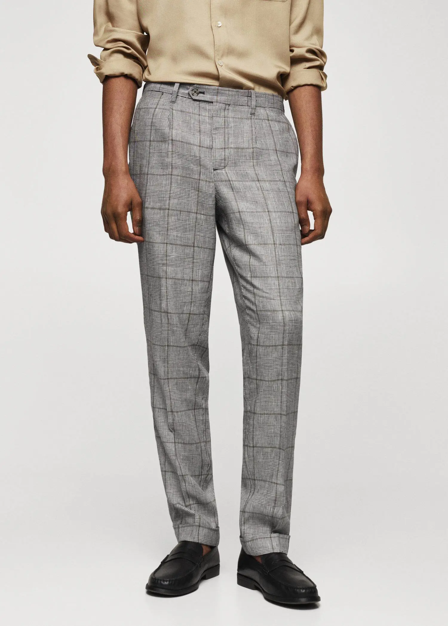 Mango Prince of Wales linen-blend trousers. a man wearing a suit and tie standing up. 