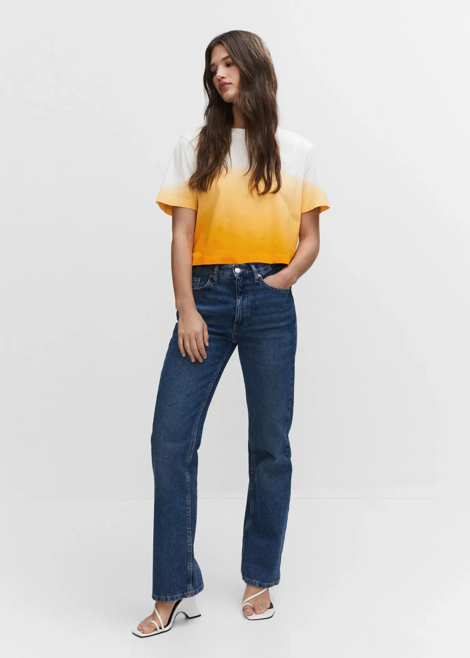 Mango Cotton ombré t-shirt. a woman in a yellow and white shirt and blue jeans. 