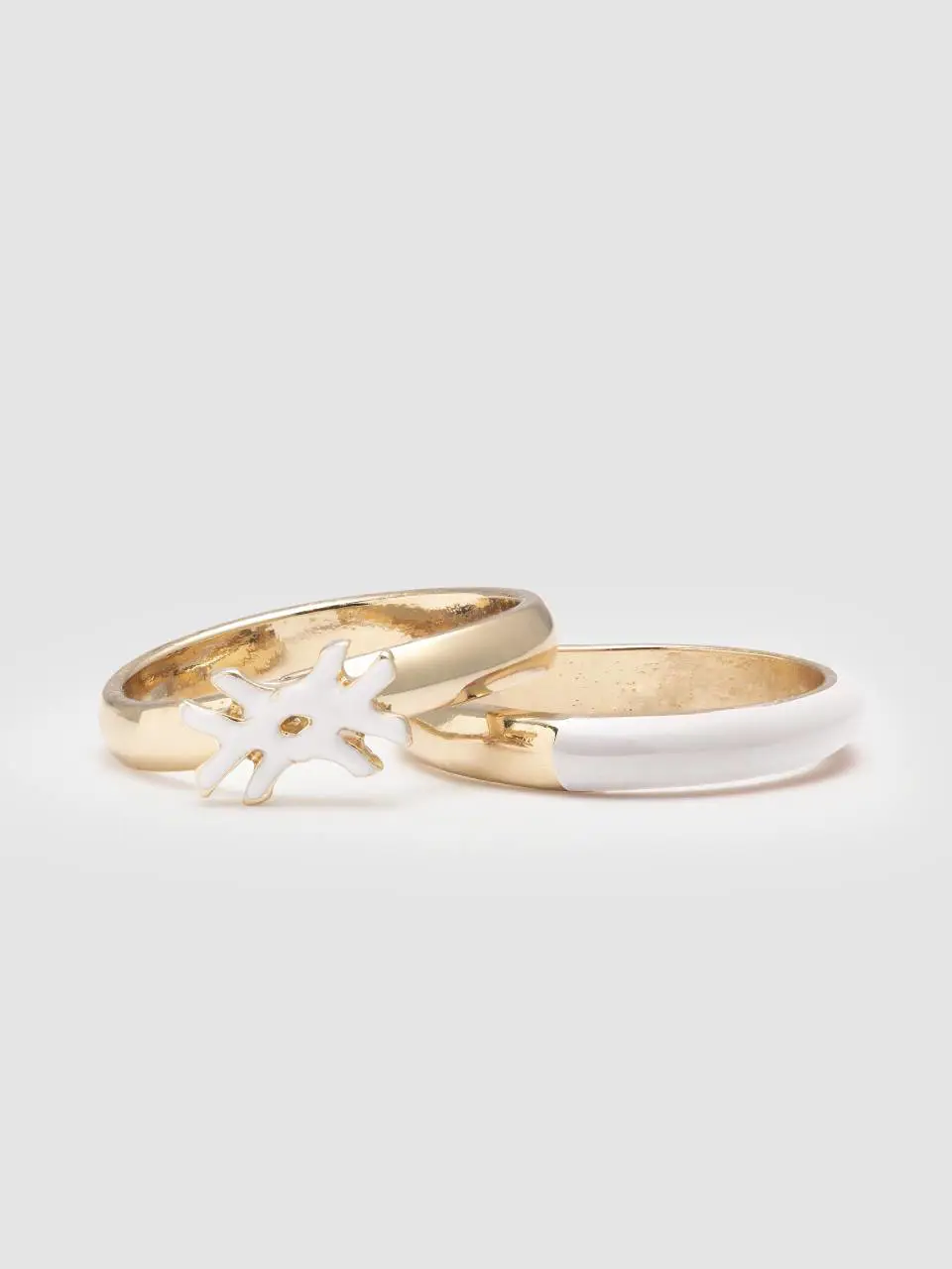 Benetton two rings with white enamelled details. 1